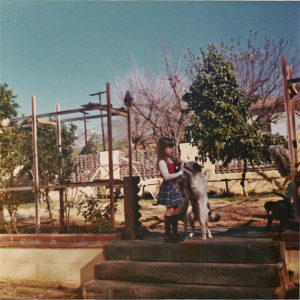 Dawn, Age 6, in Backyard with Dogs