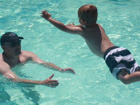 T Jumps to Daddy in the pool