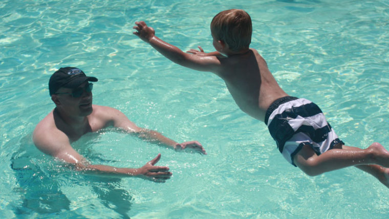 T Jumps to Daddy in the pool